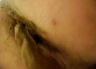 Hairy asshole is being filmed as it is shitting