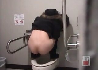 Squatting on top of the toilet and being filmed