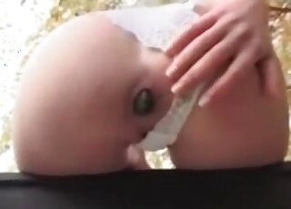 Fit wife with short hair is filmed by her partner